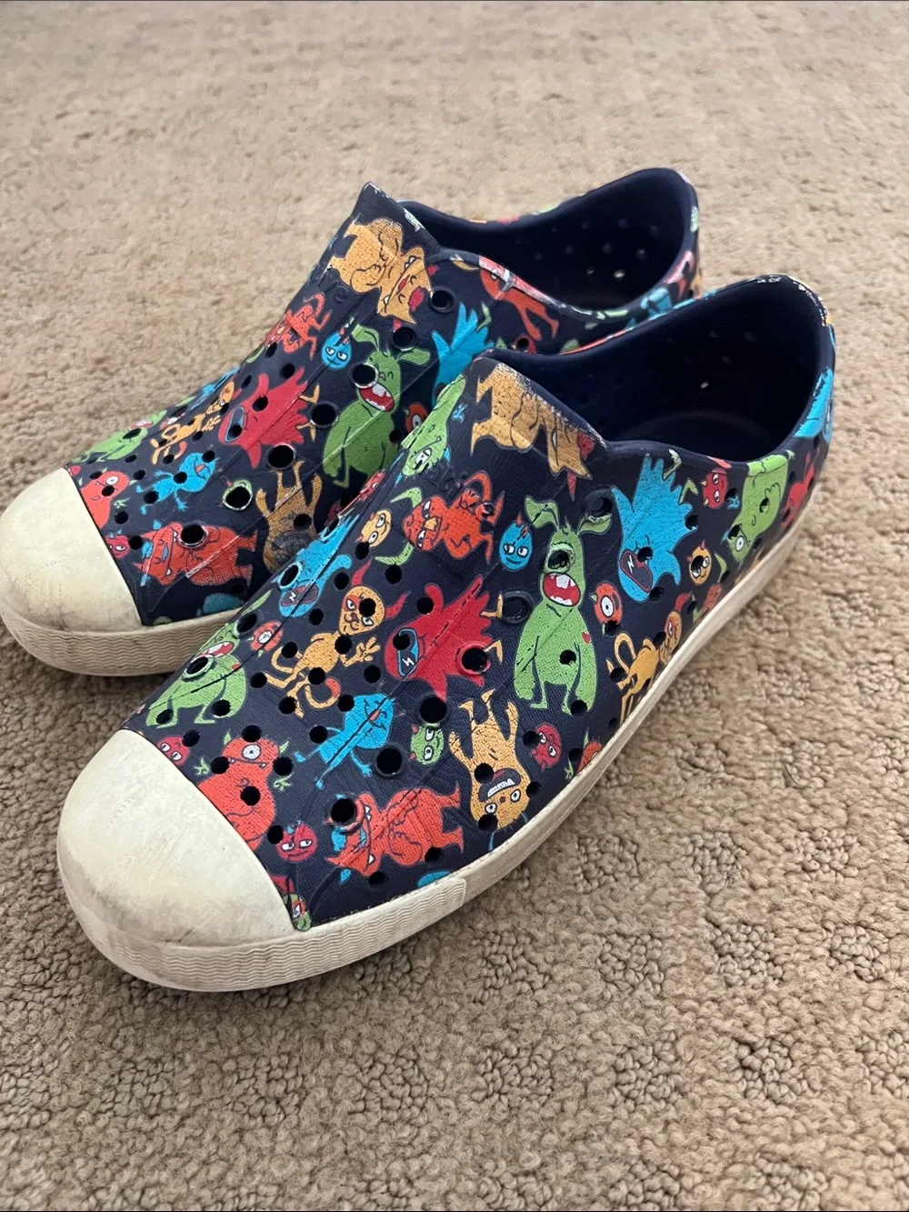 Native Kids Slip-On Shoes in Black with Multicolor Monster Print